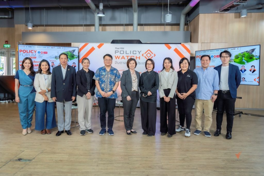 A group of eleven people stand in front of a Policy Watch forum backdrop. They are arranged in a row, posing for a photo inside a modern, well-lit room.